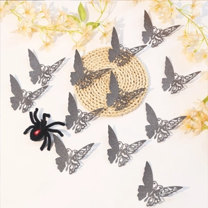 Detailed view of grey glitter hollow butterfly wall stickers and black velvet spider decor
