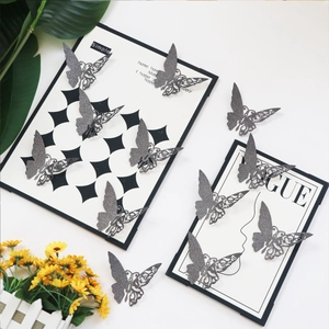 Detail of silver glitter 3D hollow butterfly wall stickers with intricate carved textures