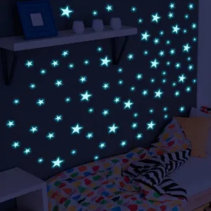 Luminous star wall stickers with glowing blue fluorescent effect for bedroom decor