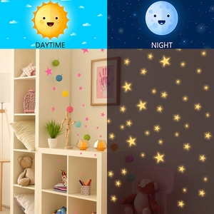 Luminous star wall stickers set for kids room showing daytime pink and night yellow glow