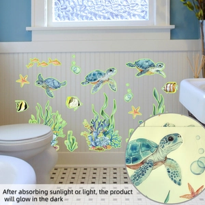 Detailed view of turtle and sea plant wall decals showing glow in the dark effect on wall