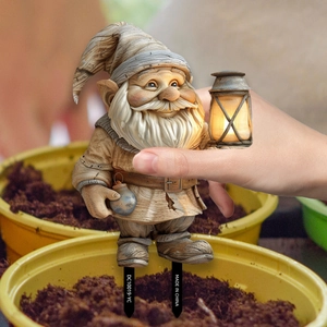 Garden gnome stake with lantern and wood carving texture for outdoor holiday decoration