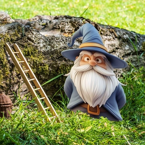 Wizard Garden Gnome Figurine with blue hat and staff standing on green garden lawn