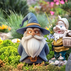 Outdoor garden gnome ornaments with blue pointed hat and basket among flowers