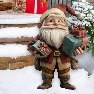Detail of Christmas gnome figurine holding green gift boxes on a snowy background