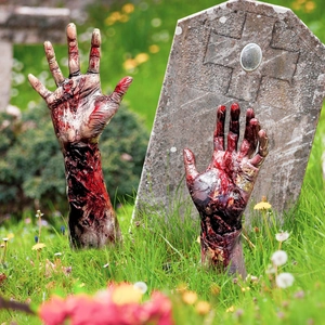 Close-up of zombie hand lawn stakes with realistic bloody textures for Halloween garden