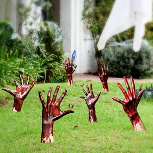 Macro detail of realistic bloody zombie hand yard stakes for Halloween lawn decoration