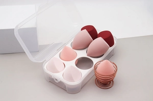 Detailed set of 7 colorful makeup sponges with a drying stand and storage box