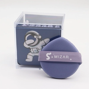 Detail of lavender teardrop makeup sponge and clear acrylic storage box with design