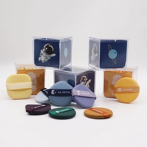Detail of multi-shape makeup sponge set with celestial themed straps in acrylic box