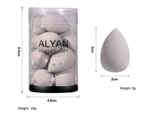 Detailed size view of gray mini makeup sponges in a jar and single droplet puff