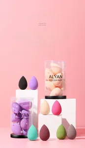Macro detail of multi-colored teardrop makeup sponges with a transparent storage tube
