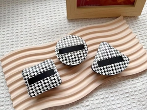 Houndstooth puff set with round square and teardrop shapes on a pink ripple tray