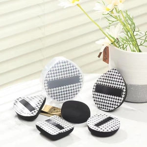 Houndstooth makeup puff set with drop, triangle, and round sponges in a storage box