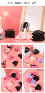 Vista detallada de borlas de terciopelo triangulares en varios colores para fijar maquillaje