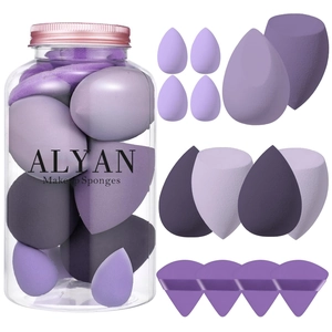14-piece purple makeup sponge set in transparent storage jar with various blending shapes
