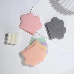 Extra large cat paw shaped cleansing sponges in six vibrant colors on a white background