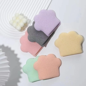 Detail view of colorful cat claw shaped cleansing sponges in various pastel shades