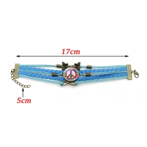 Vintage braided leather bracelet with pink flower peace sign and butterfly charms