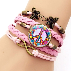 Pink braided leather multi-layer bracelet with peace sign, butterfly and infinity charms