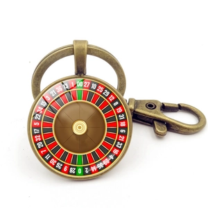 Vue détaillée du porte-clés roulette en bronze avec chiffres colorés et fermoir homard