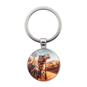 Detailed close-up of a silver keychain with an exotic desert camel glass dome pendant