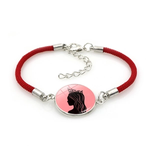 Hand-woven red rope bracelet featuring a crown-wearing female silhouette on round pendant