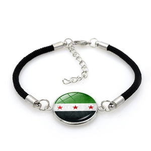 Adjustable woven bracelet with Syria national flag glass dome charm on white background
