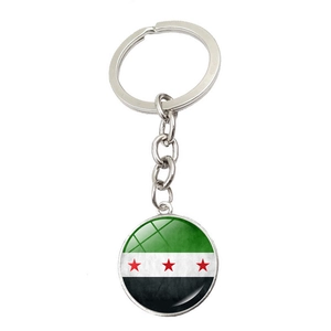 Syria flag keychain with silver metal ring and circular pendant on white background