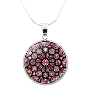 Detail of silver round pendant necklace featuring a red and black cathedral window glass art