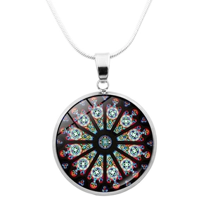 Detail of silver mandala glass pendant showing the intricate geometric pattern and link chain