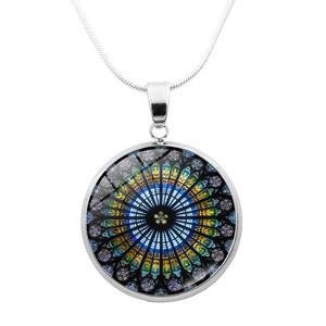 Macro detail of gothic rose window glass pendant necklace with silver mandala pattern