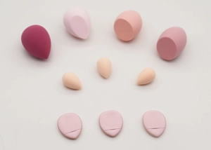 Top view of 10-piece makeup sponge set with gradient pink beauty blenders and puff