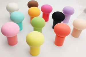 Colorful mushroom head makeup sponges with handles in a vibrant multi-color arrangement