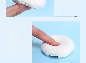 Detailed macro shot showing the high-elasticity cushion and soft plush texture of white powder puff