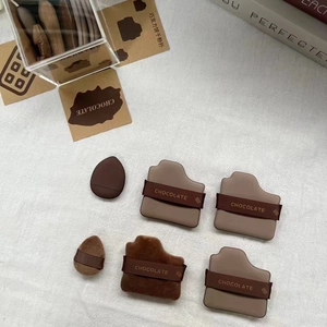 Detailed set of chocolate-themed mini finger puffs in various cookie shapes and textures