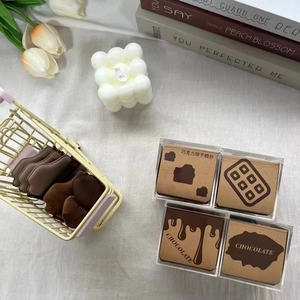 Detail of 6-piece chocolate cookie makeup puff set with mini thumb concealer sponges