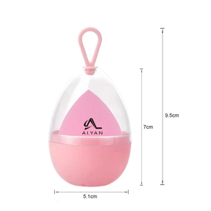 Detailed dimensions of pink makeup sponge blender in egg-shaped storage box with hanging loop