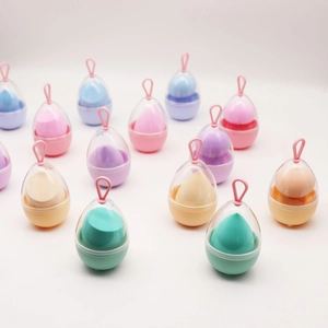 Detailed view of colorful makeup sponges in portable egg-shaped hanging cases