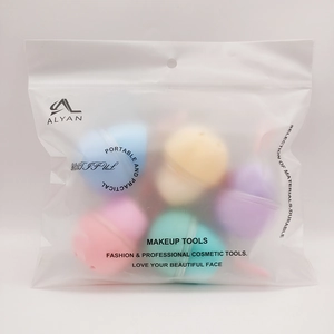 Detailed view of colorful makeup sponges in frosted translucent packaging with logo