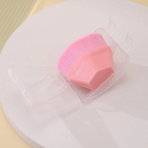 Pink hexagonal foundation brush with dense bristles and protective clear storage case