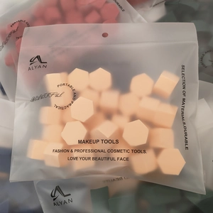 ALYAN bulk pack of hexagonal makeup sponges in an orange frosted zip-lock storage bag