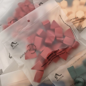 Bulk set of geometric makeup sponges in various shapes and colors in a matte pouch