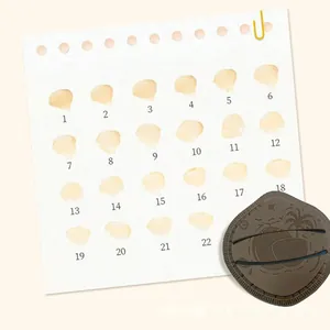 Macro detail of brown makeup puff with embossed palm pattern and 22 foundation swatches