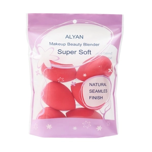 Close-up of 6 red teardrop makeup sponges in a purple zip pouch with hanging hole