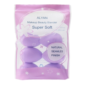 Macro shot of light purple teardrop makeup sponges in a transparent zipper storage pouch
