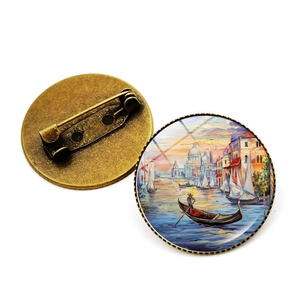 Detailed view of vintage Venice oil painting brooches with bronze metal pin backing
