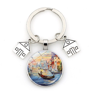 Detailed macro of metal keychain with Venice gondola painting and house charms
