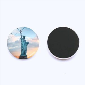 Round crystal glass fridge magnet featuring Statue of Liberty landscape with back magnet