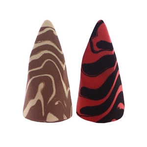 Detail view of two-tone marble texture makeup sponges in conical shape for makeup